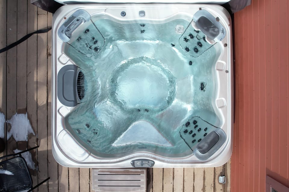 Slip into bubbling bliss with your private hot tub, where therapeutic jets melt away stress under the open sky.