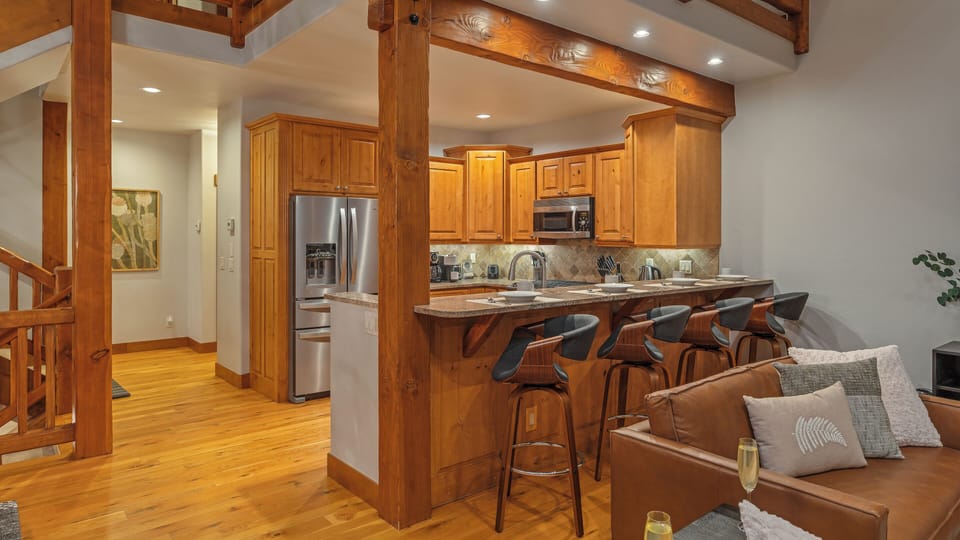 Kitchen, Main Level - Fully-equipped kitchen with breakfast bar seating