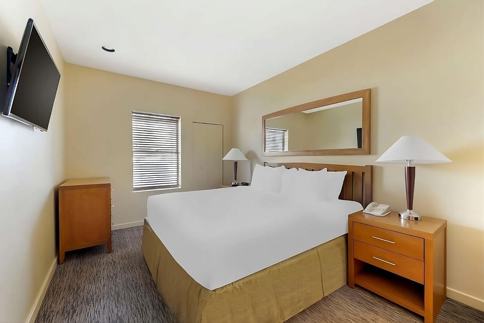 Unwind in crisp king bedding with easy in-room entertainment.