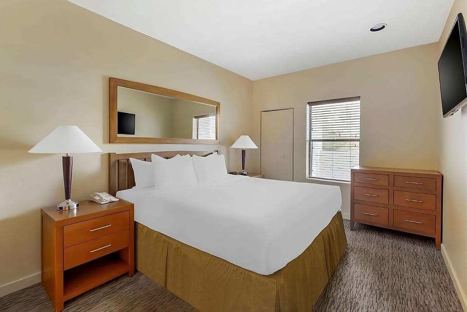 Relax into a bright king bedroom with plush, hotel-style comfort.