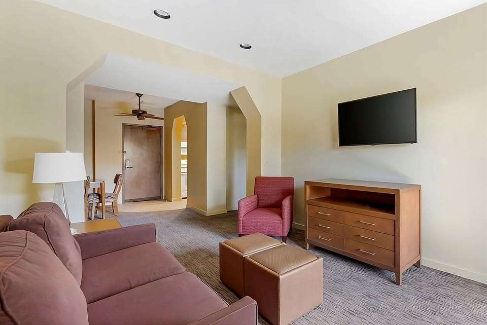 Lounge comfortably with generous seating and a large TV.