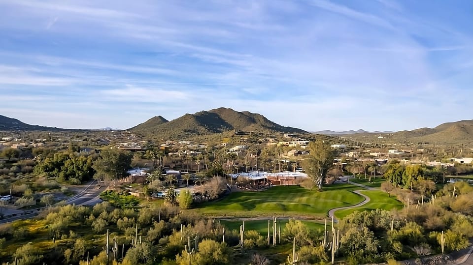 Breathe in wide-open fairway panoramas framed by mountains.