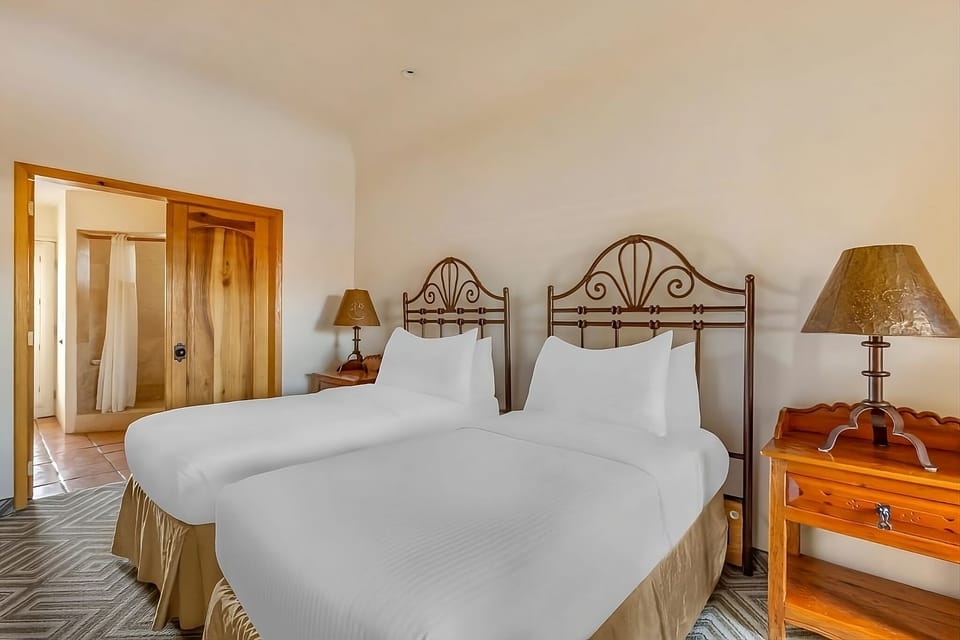 Settle into twin beds with crisp linens for restful nights