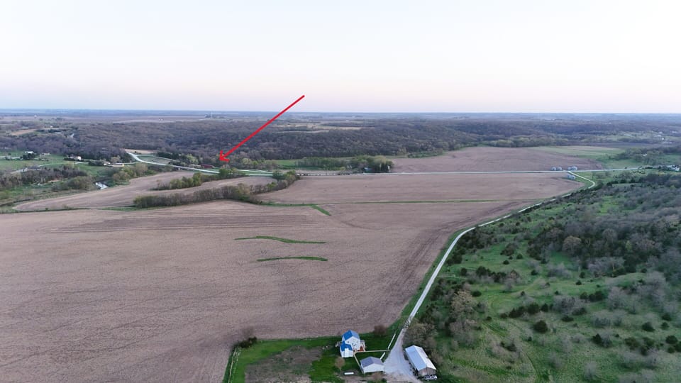 red arrow depicts Holliwell Covered Bridge just a short walk from this house