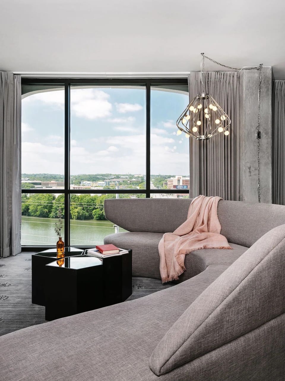 Sip and relax beside dramatic windows framing river views.