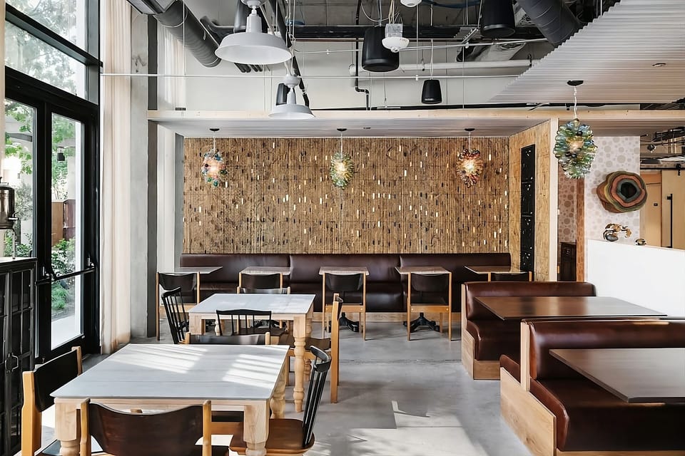 Enjoy relaxed meals in warm, light-filled designer seating.