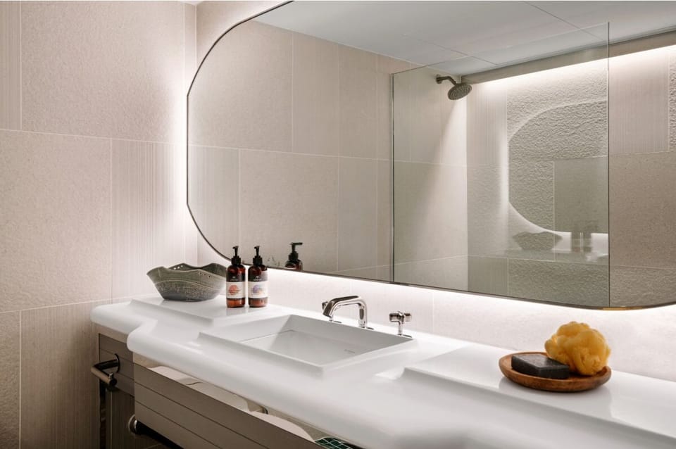 Ease into mornings with soft lighting and generous counter space