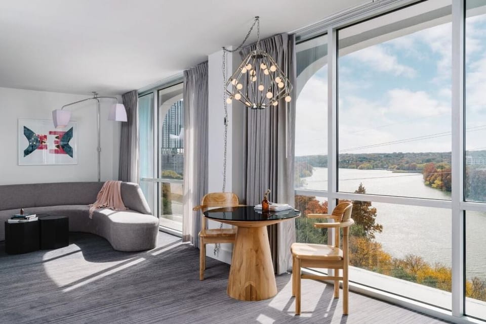 Sip morning coffee beside floor-to-ceiling windows and water.