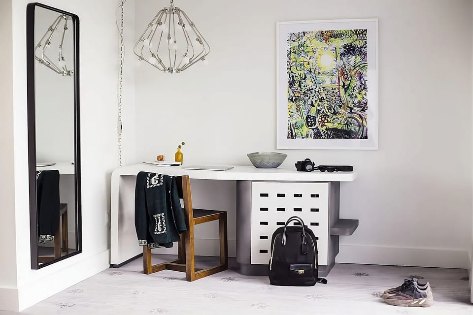 Settle in with a convenient desk and full-length mirror.