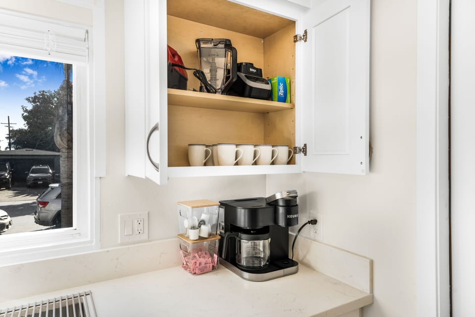 Keurig Coffee Machine, pods and sweetener provided.  