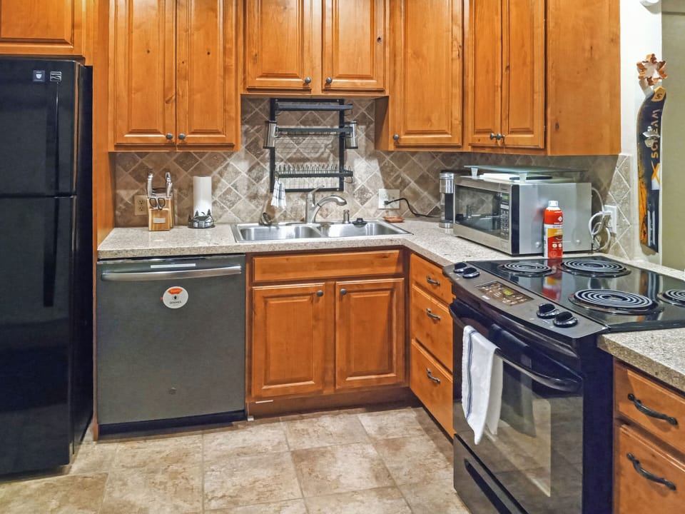 Kitchen is ready for cooking your favorite meals! Pots, pans, basic spices ready