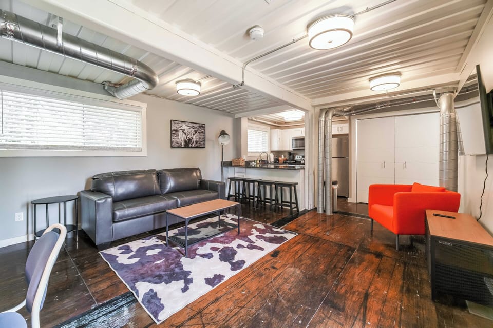 You enter right into the living area that includes a sleeper sofa and 55"Smart TV.  Notice ample bar seating and the fully appointed kitchen