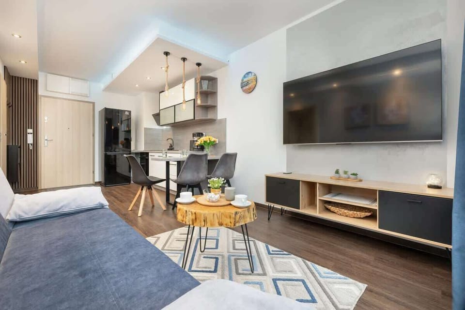 The living and dining area with soft lighting, creating a warm and inviting atmosphere for guests.

