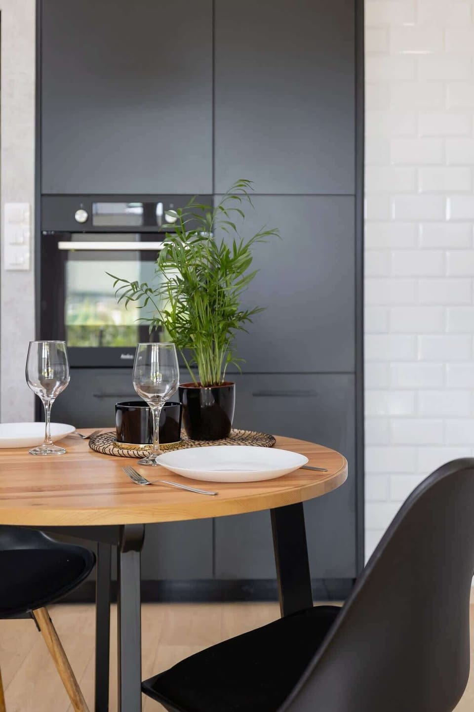 A close-up of the dining table with a decorative centerpiece, creating a welcoming atmosphere.

