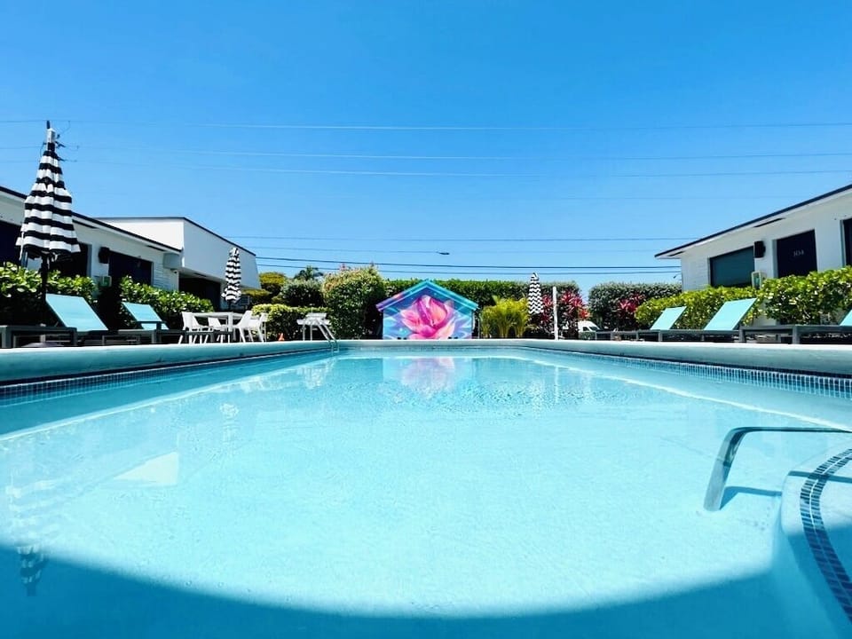 The Pier Walk pool house mural is the perfect backdrop for your next vacation.