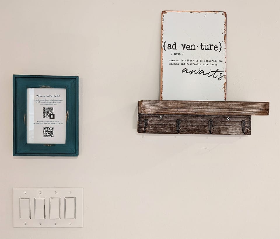 Entry way Featuring convenient QR code for WiFi and our online guidebook at your fingertips.