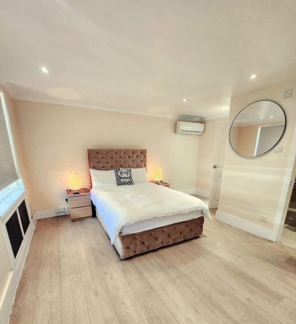 master bedroom with wardrobe and king size bed, towels provided