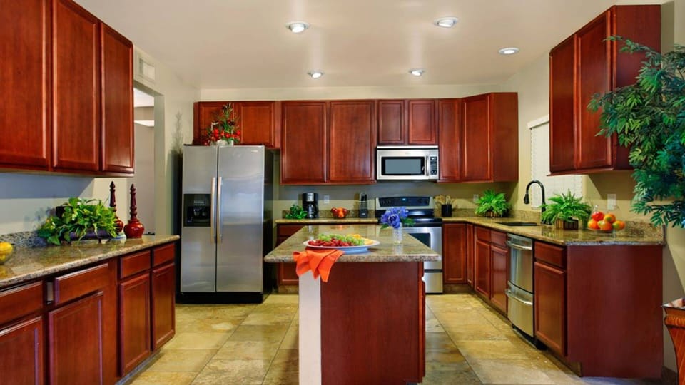 Open kitchen with large island area is super conveniently located to living areas.