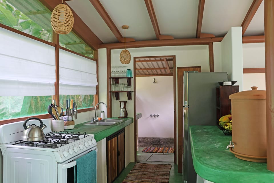 Kitchen with full size refrigerator and stove has everything you need.