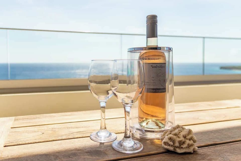 Cheers to island life. Whether you're celebrating something special or simply soaking up the moment, there's no better place to enjoy a chilled glass of wine than with this stunning ocean view in front of you.