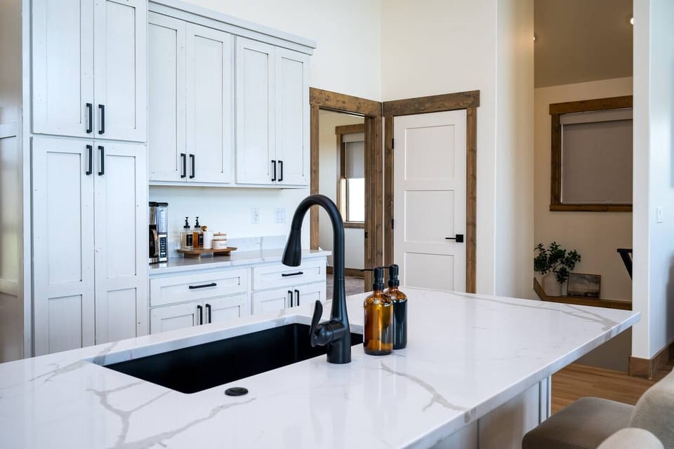 Indulge in culinary delights in the cozy kitchen, equipped with ample amenities for creating wonderful dinners with friends and family.