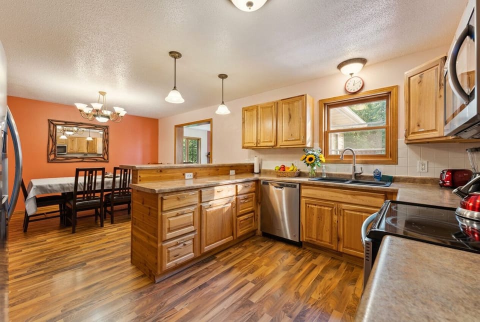 Spacious wood-accented kitchen with island and open dining area