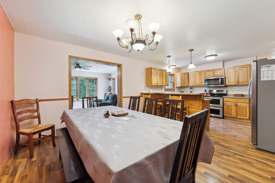 Table w/7 chairs, bench that seats 3, 4 more chairs in garage, 3 bar stools