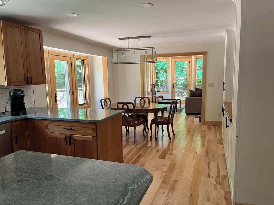 view of dining room and sunroom from kitchen