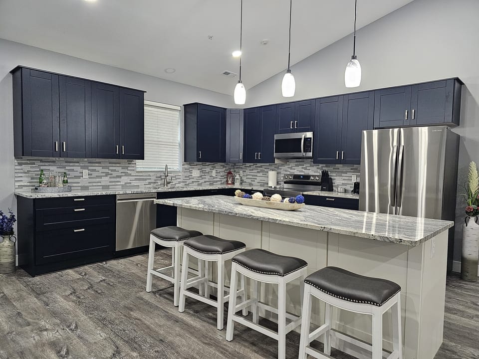 Chef‑ready kitchen with modern appliances and plenty of prep and seating space.