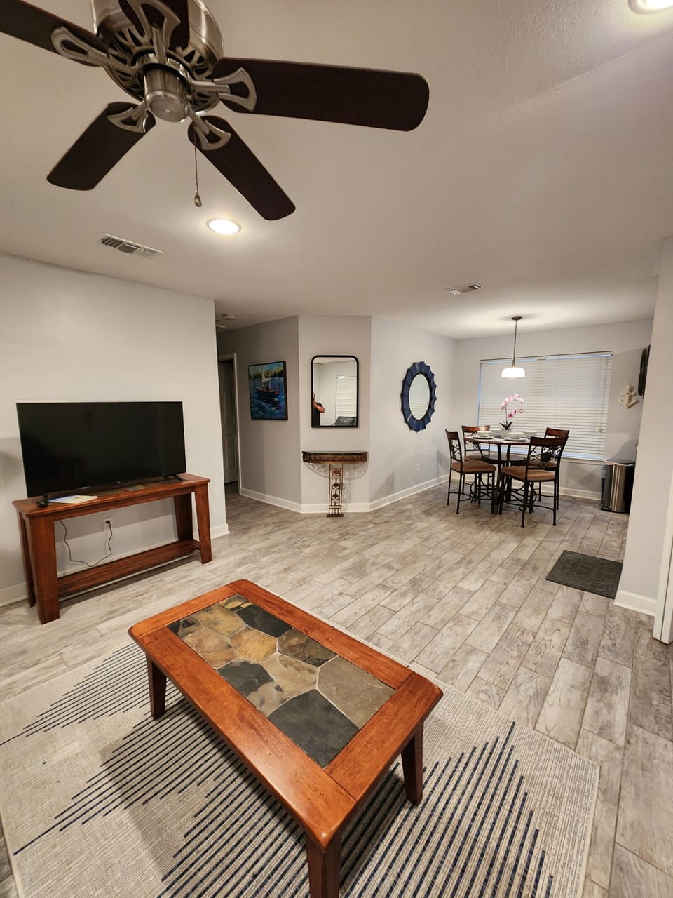 Open floor plan living room and TV you can see from kitchen