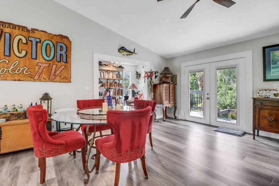 The eclectic decor is epitomized in the dining table for 8 in the open living space (additional chairs available.)