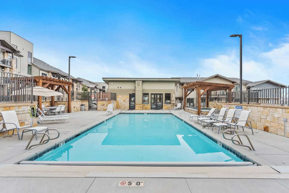 - Sparkling outdoor pool perfect for swimming and lounging under the sun  
- Relax on poolside chairs or shaded cabanas after a refreshing dip  
- Ideal vacation spot with resort style amenities and water views