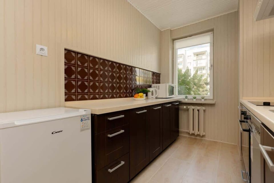 Bright kitchen with cooking utensils. 