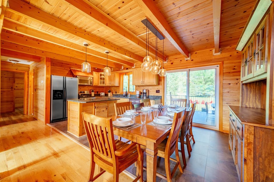 Restoration Hardware lighting, stainless appliances granite counters and a view to the outdoors make a wonderful space to cook and gather