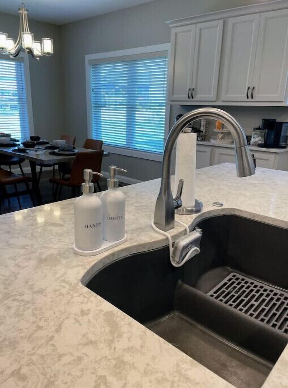 Large island in kitchen with counter height stools.