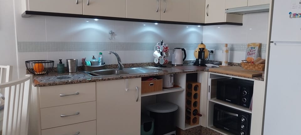 fully equipped kitchen, mini oven, hob, m/wave, toaster, kettle, coffee machine
