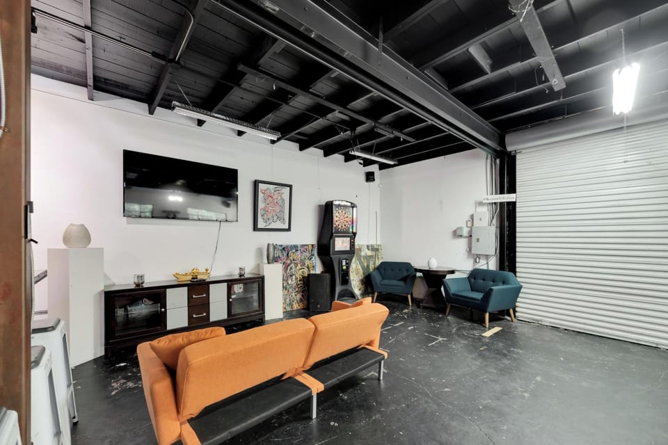 A cozy living space featuring a Smart TV and various seating options.