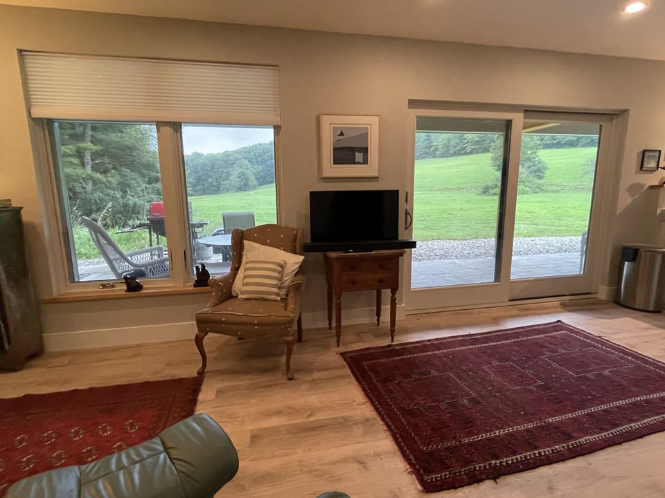 View from living room out to porch and field