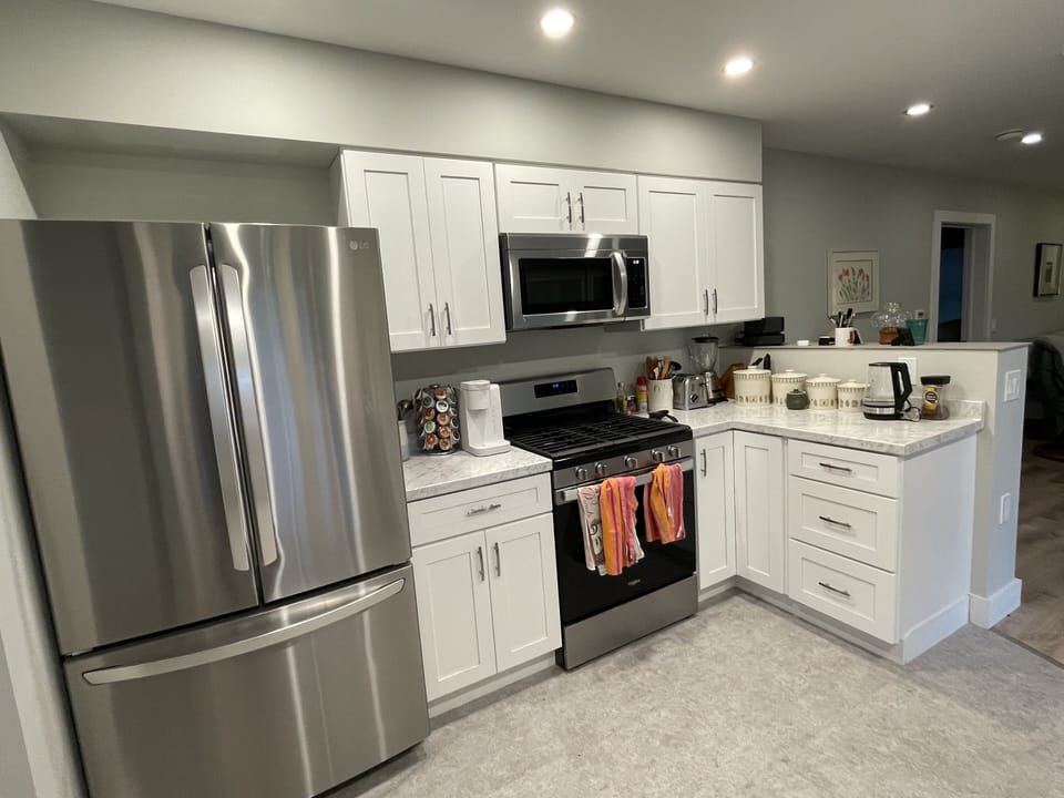 Full stainless refrigerator/freezer, with ice maker. Gas Stove and microwave.