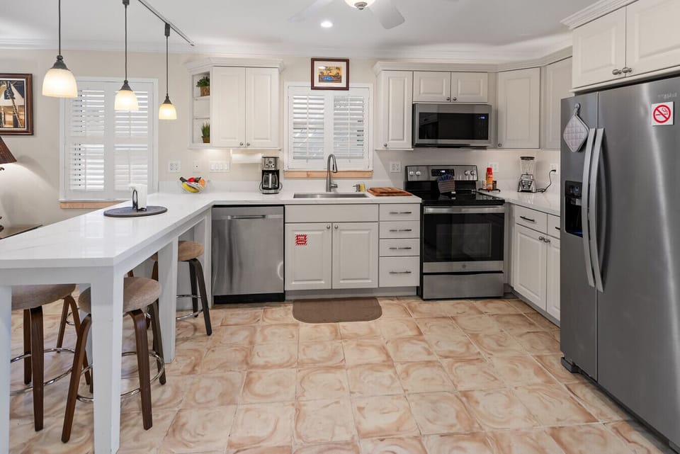 Fully equipped kitchen, double door frig, glass top stove, dishwasher, coffee maker, toaster, blender, microwave and all cooking ware provided as well as coffee, sugar, creamer, salt, pepper, saran wrap, foil, baggies, napkins, dishwasher soap, cleaning s