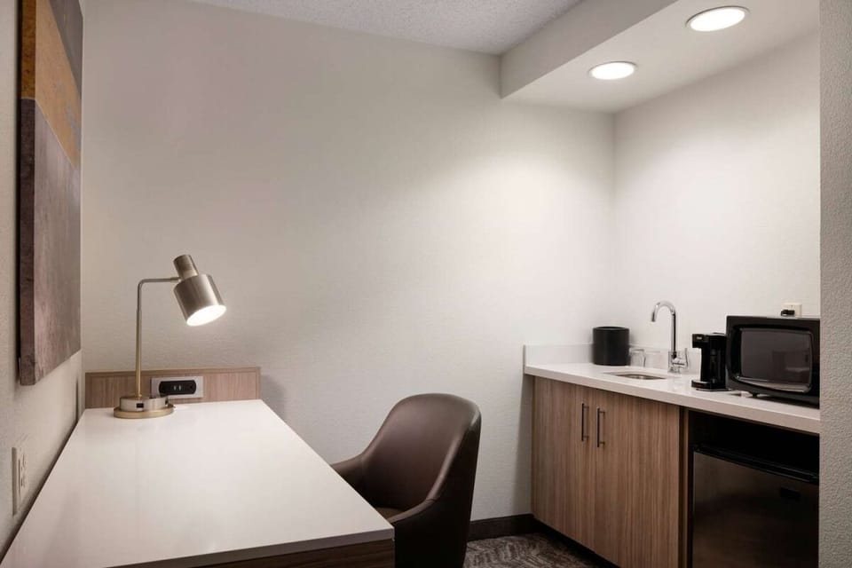 Brew fresh coffee and snack anytime with handy kitchenette.