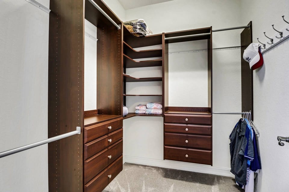 A built-in closet system in the primary bedroom provides plenty of space for you to keep your belongings - no need to pack lightly here!