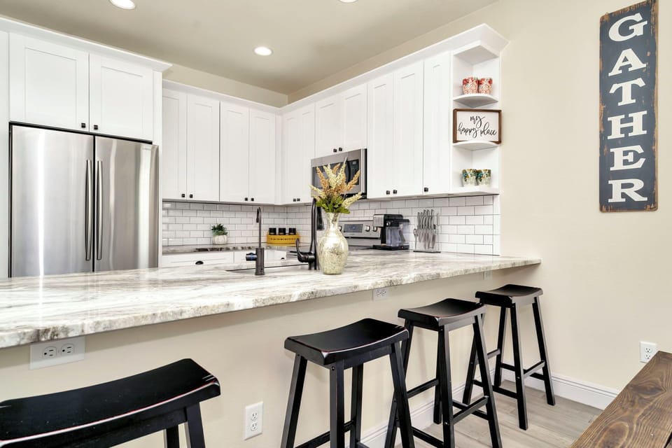 Enjoy drinks at the kitchen bar while watching the designated chef in action