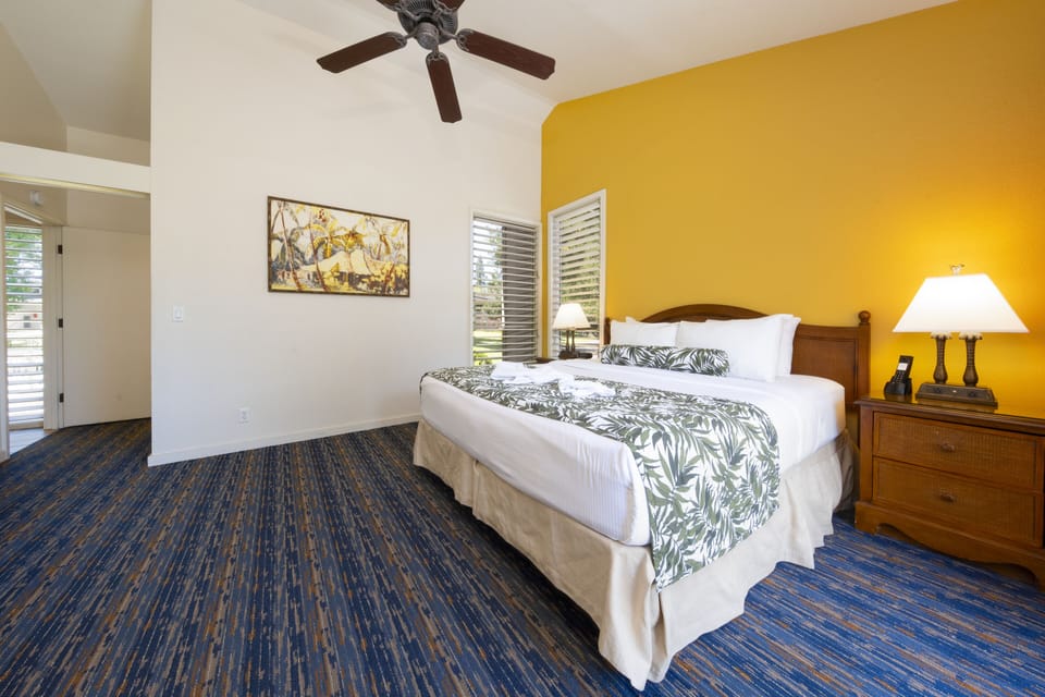 Sink into crisp linens in this sunny, island-inspired bedroom.