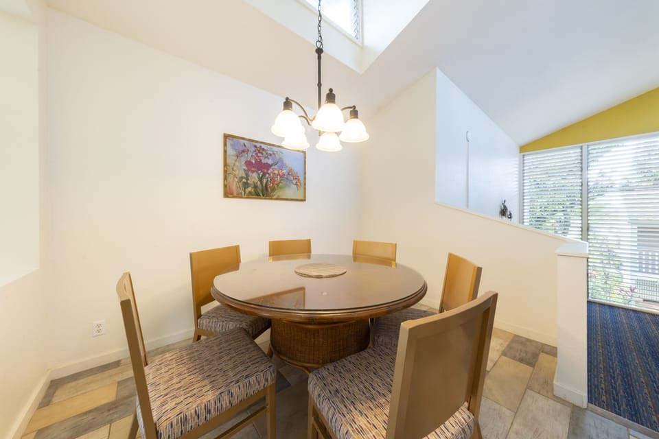 Share meals and stories around a cozy round dining table.
