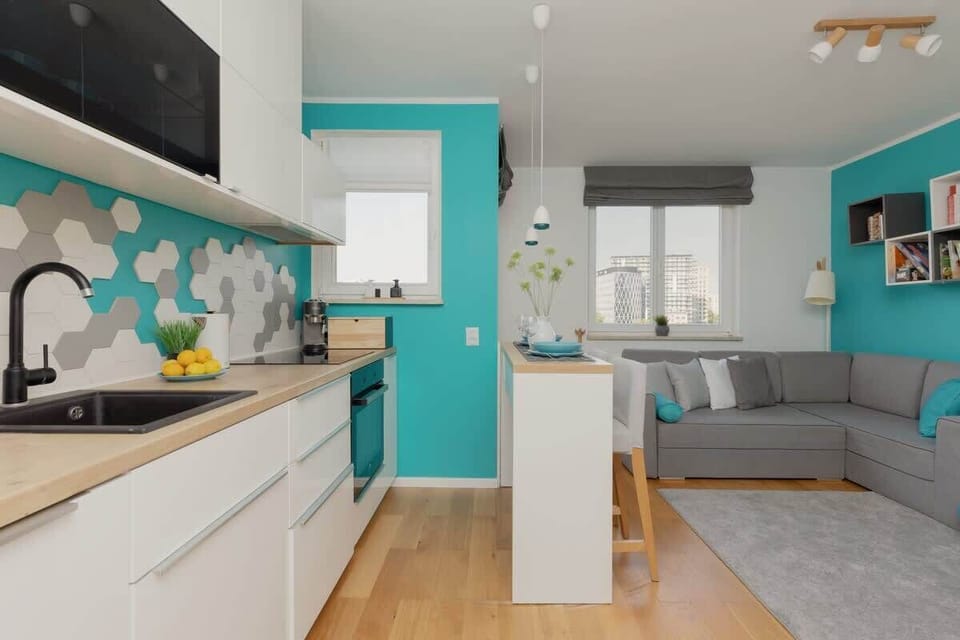 Kitchenette with plenty of kitchen utensils and dishes. 
