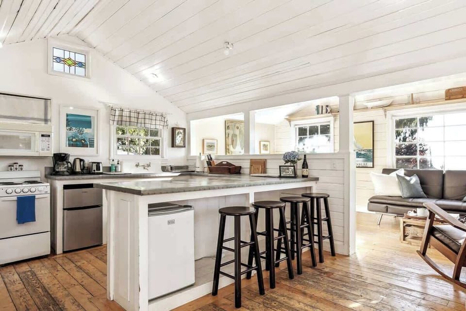 Bright open kitchen with breakfast bar seating, perfect for casual meals while staying connected to the cozy living space.