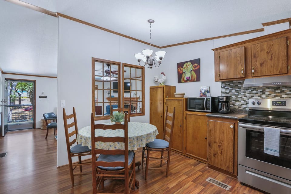 The kitchen is conveniently situated off of the living room and has formal seating
