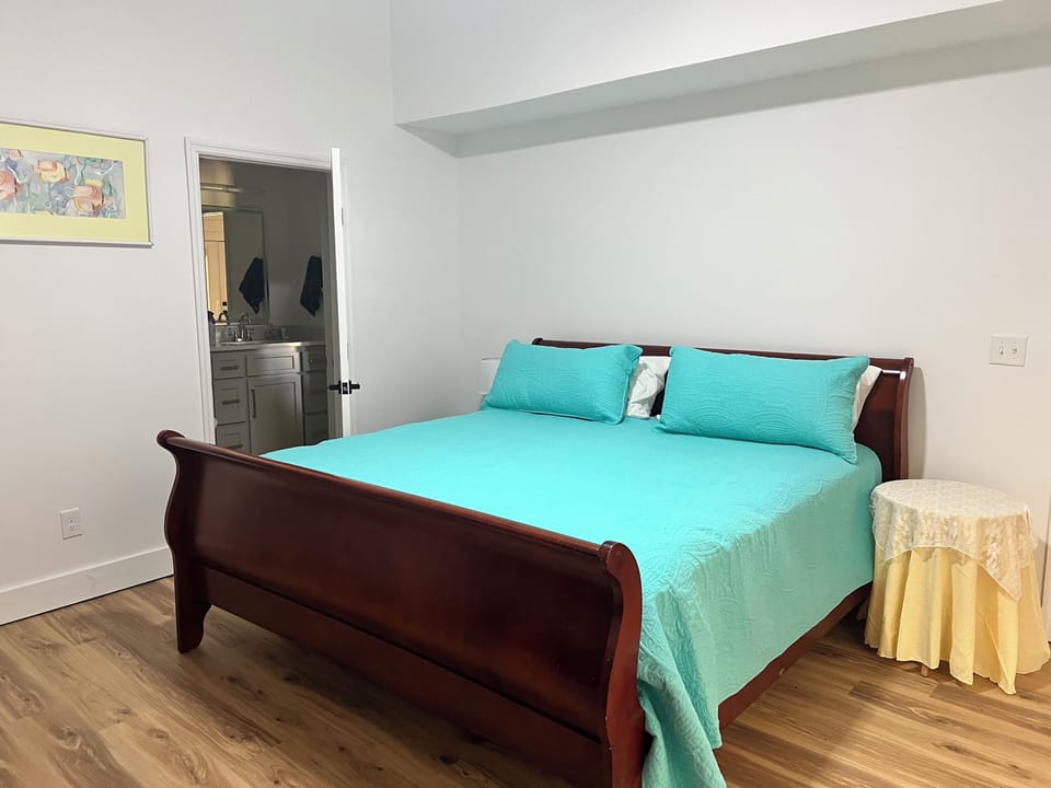 King bed downstairs with access to bathroom from room. 