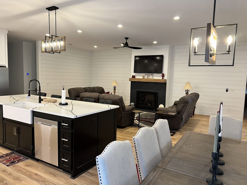 Shows living room, kitchen and dining all in one.